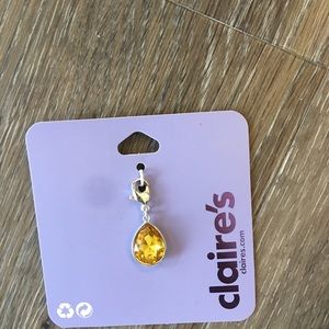 Claire’s amber teardrop charm